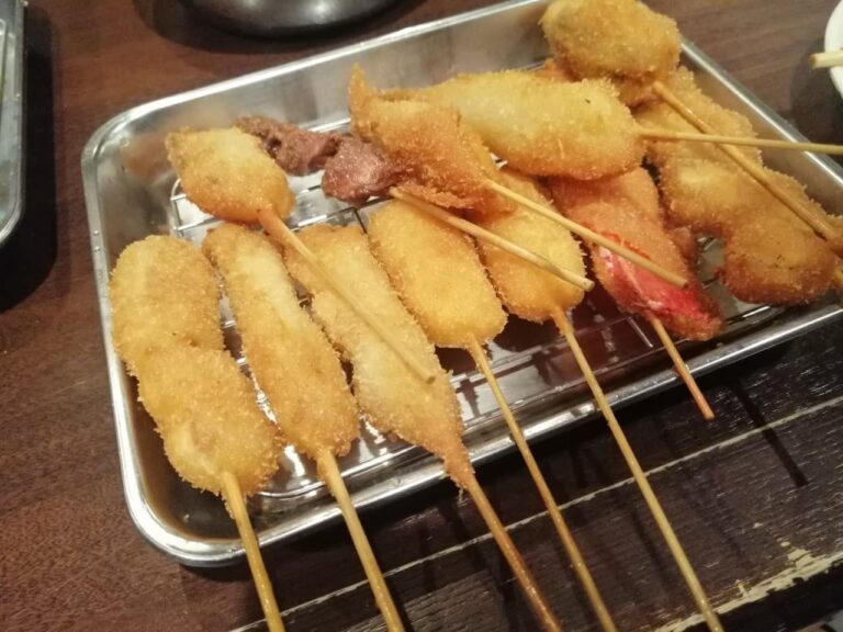 Kushikatsu, a dish composed of skewered ingredients covered with Panko and then grilled